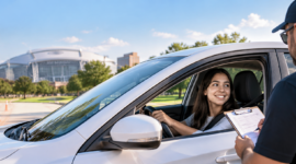 A student takes a road test in Arlington TX while a driving instructor evaluates her skills near Arlington driving test facilities